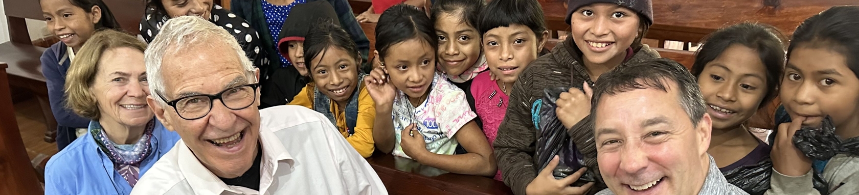 Three Cross View leaders with a group of children in Guatemala