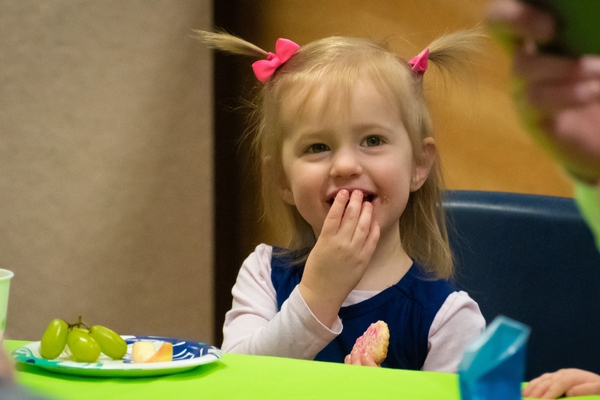 Young girl eating snacks