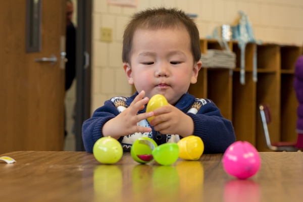 Toddler on an Easter egg hunt