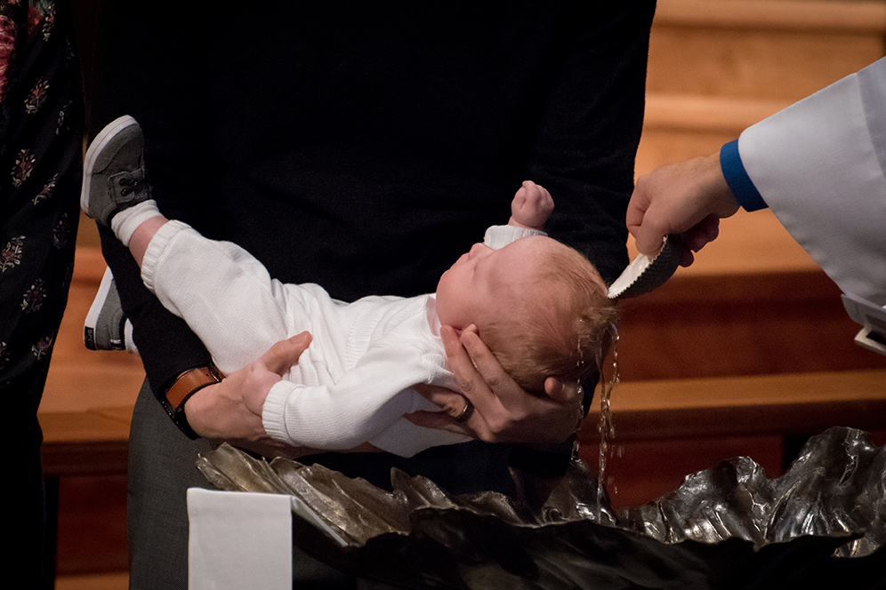An infant being baptized