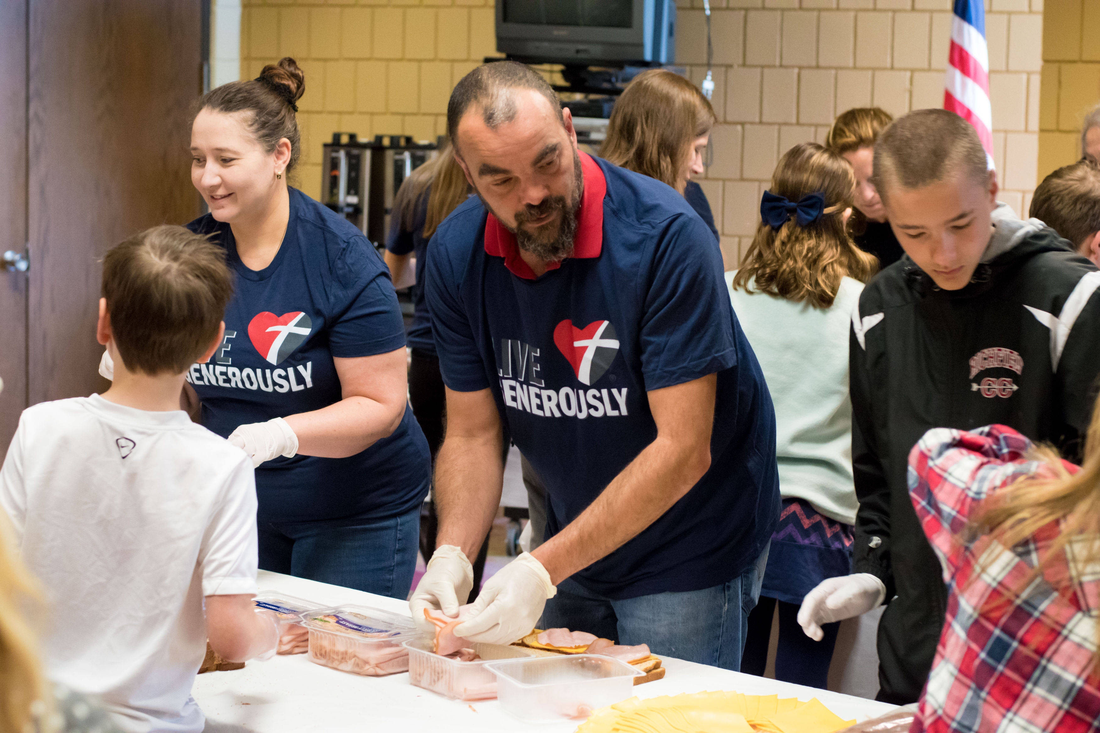 Cross View volunteers make sandwiches for homeless people.