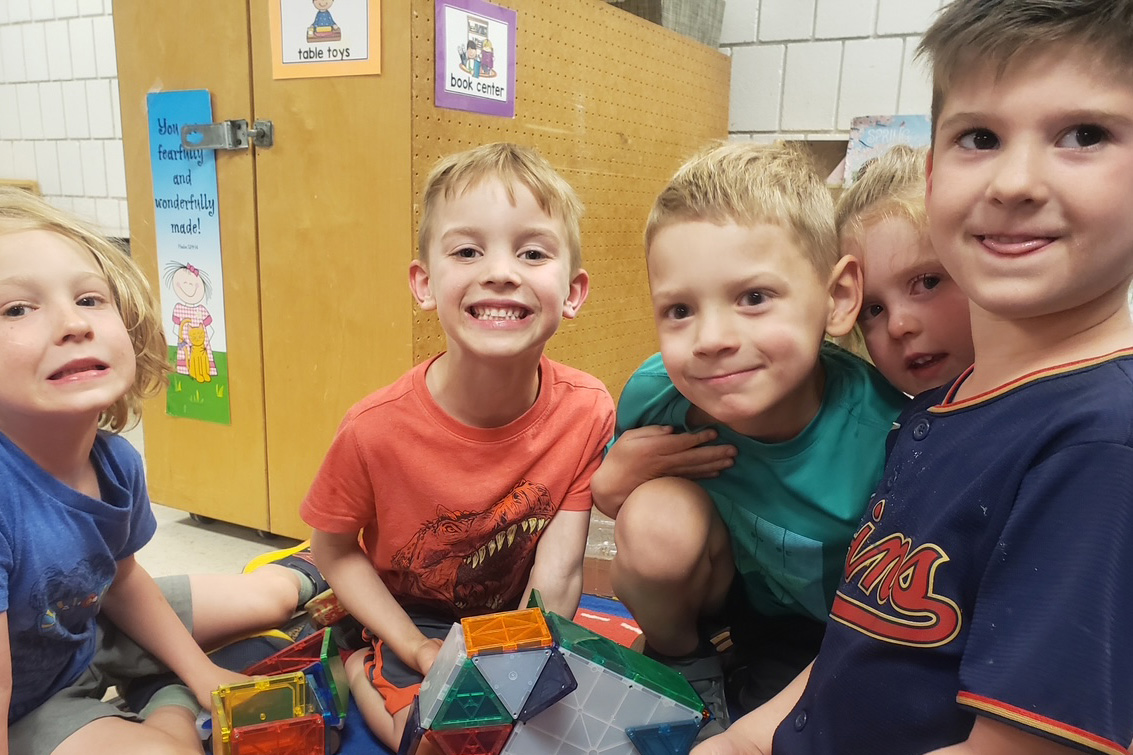 Teacher with children at Cross View ECC