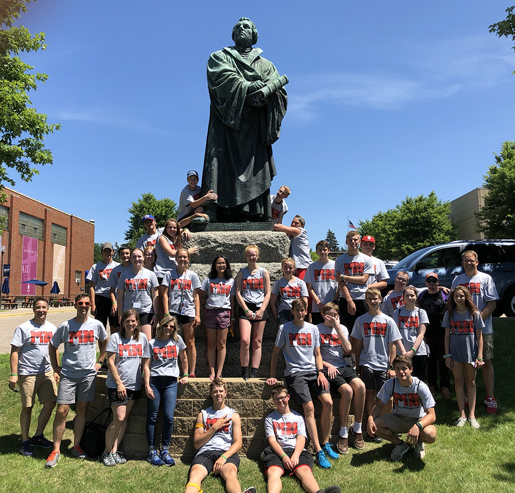 Cross View Youth in front of the Martin Luther statue at Concordia University,  St. Paul